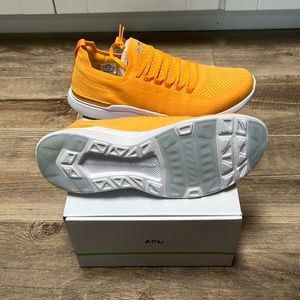 APL Women’s athletic shoes. Size 11, bright orange, brand new